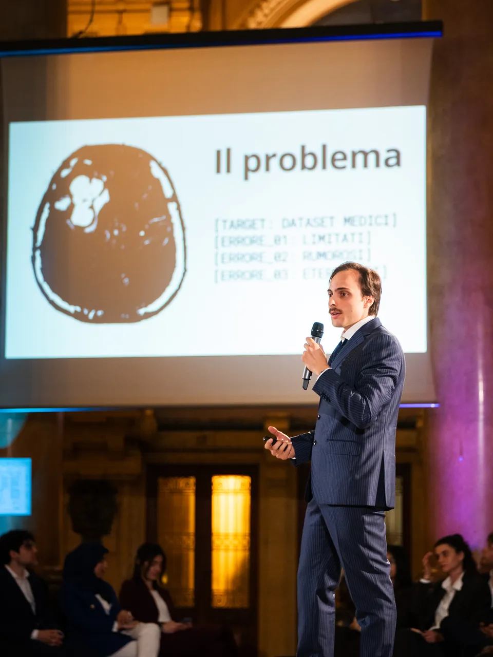 The presentation of Quantum, with the image of a brain on the screen