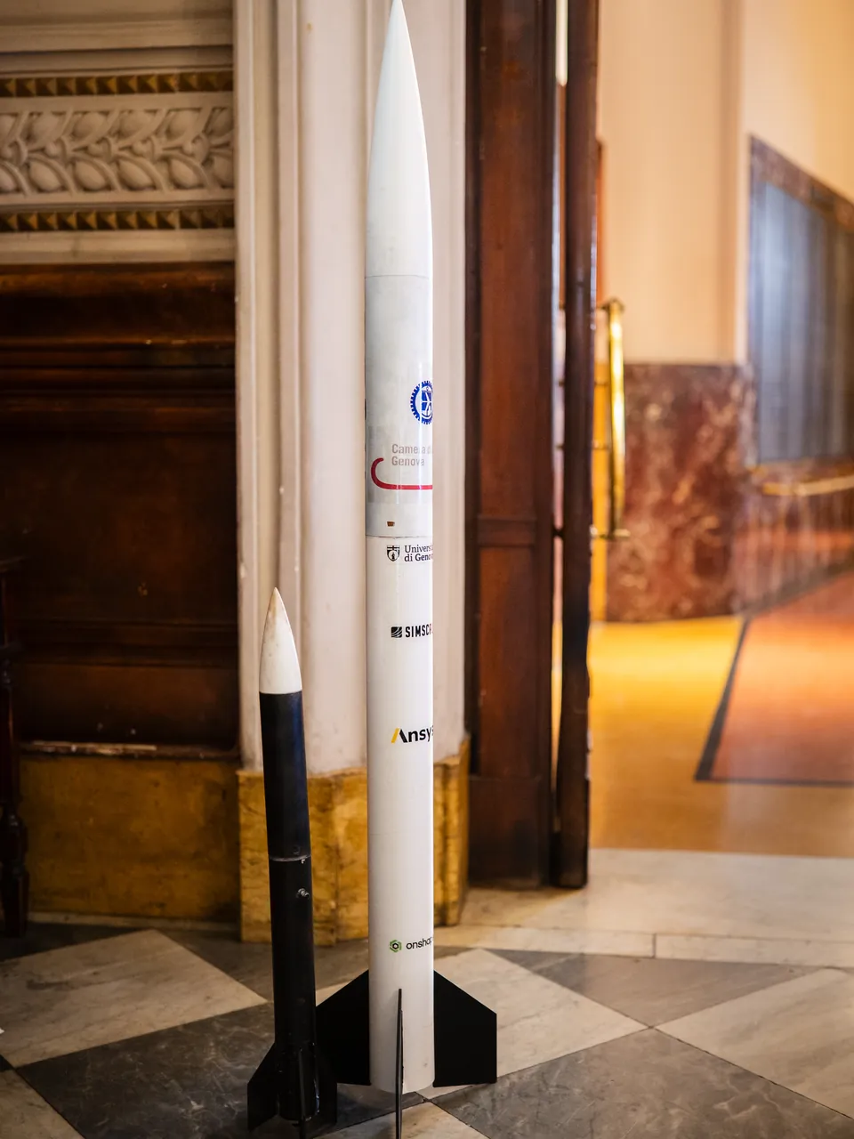 Two rockets standing in the hall of Palazzo della Borsa